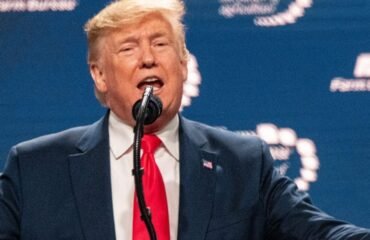 Gabe Evans speaking during a rally with Donald Trump