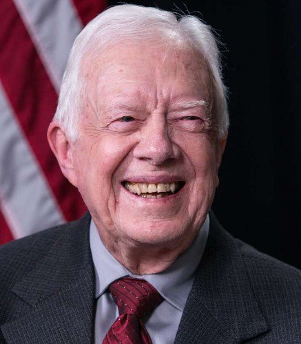 Jimmy Carter smiles during a book signing